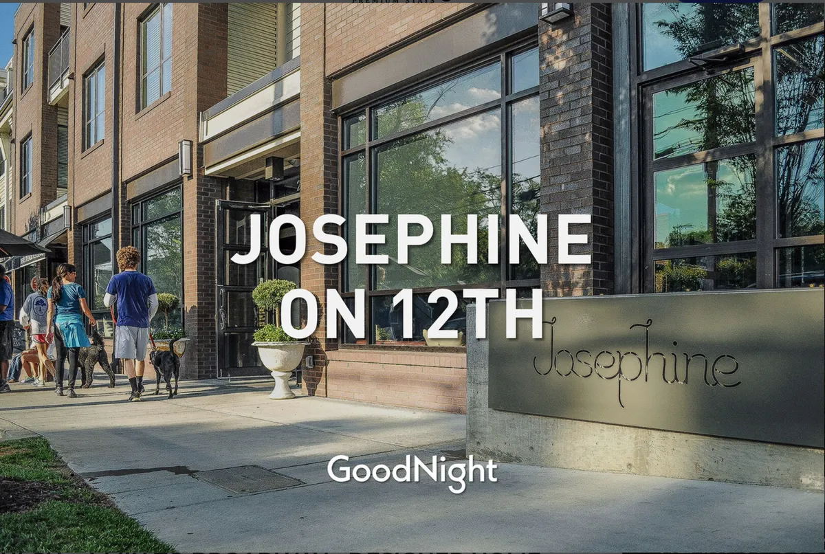 The image shows the facade of a popular neighborhood eatery, 'Josephine on 12th,' with people walking their dogs and engaging in casual conversation. The scene radiates a community vibe, with inviting sidewalks and visible neighborhood activity.
